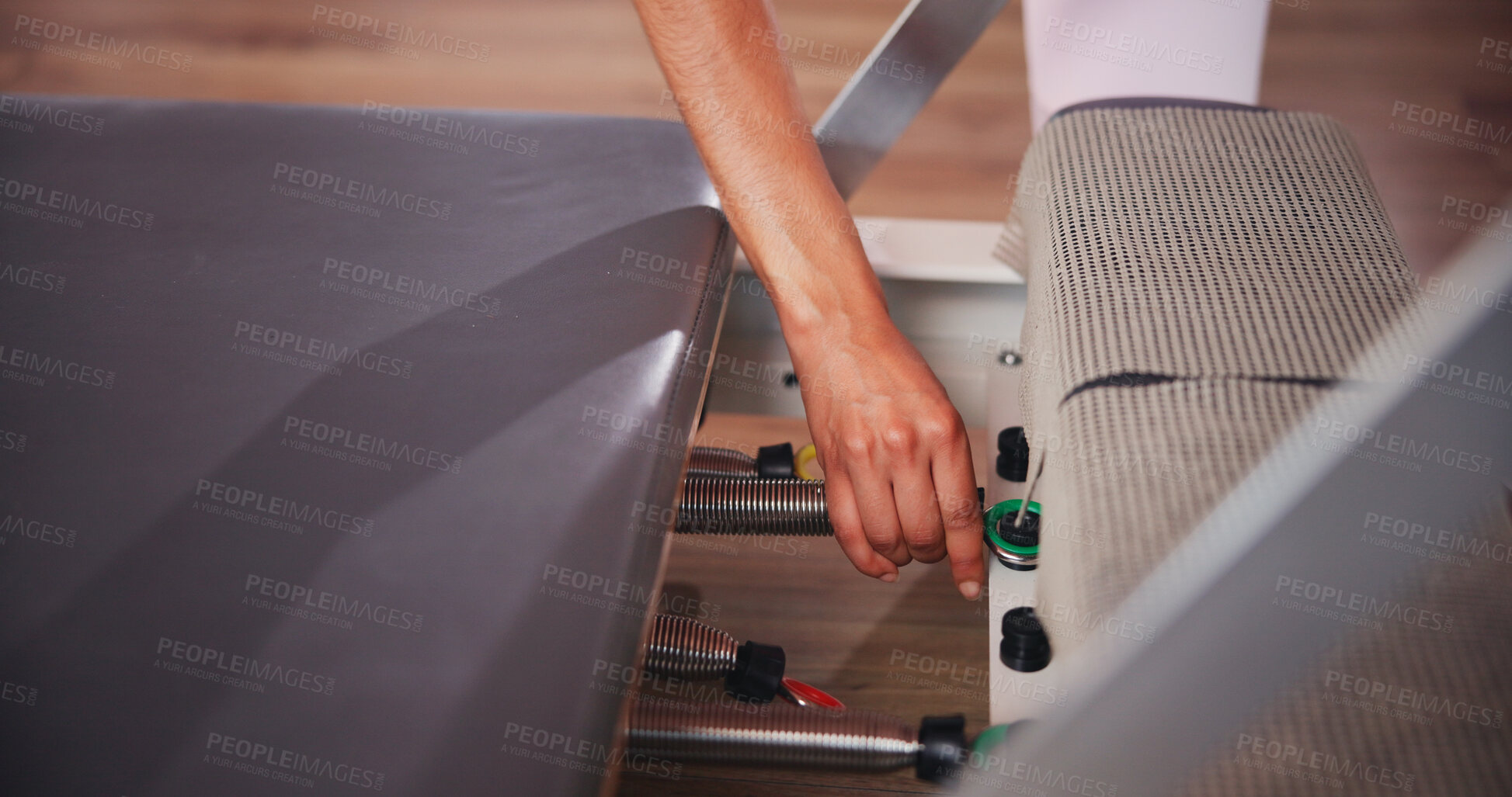 Buy stock photo Fitness, pilates and hands of person with machine in class for exercise, practice and training. Prepare, start and athlete in gym with reformer equipment set up for health, wellness and challenge