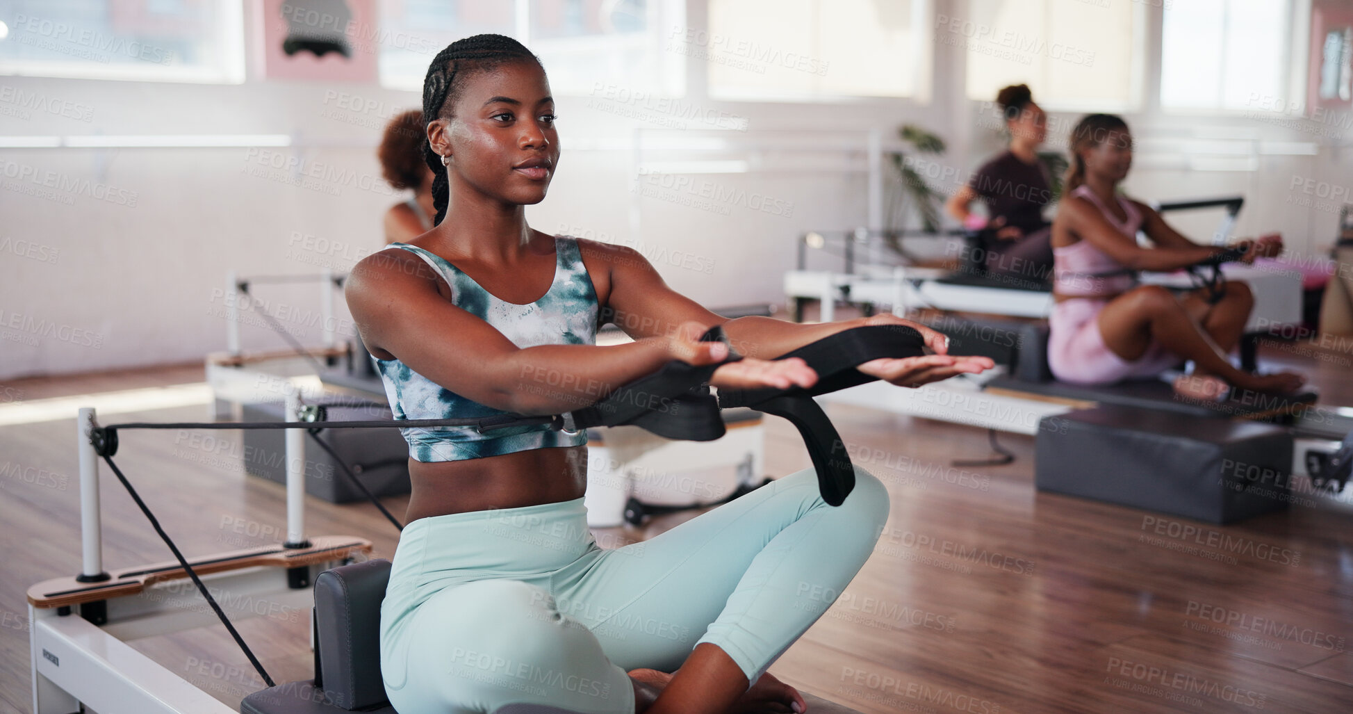 Buy stock photo Exercise, pilates and reformer with woman in studio for improvement, training or workout routine. Concentration, equipment and fitness with athlete on machine in class for challenge or performance