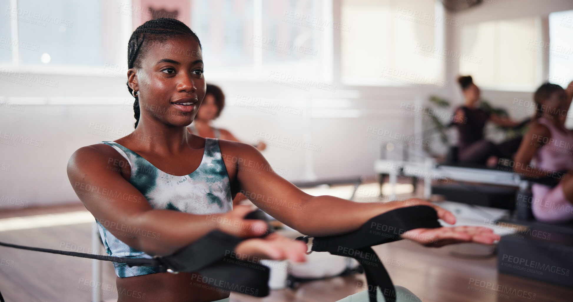 Buy stock photo Fitness, pilates and resistance with woman in class for improvement, training or workout routine. Concentration, equipment and exercise with person on reformer machine for challenge or performance