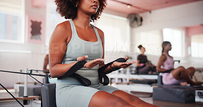 Buy stock photo Fitness, pilates and reformer with hands of woman in class for improvement, training or workout routine. Equipment, exercise and resistance with person on machine in gym for challenge or performance