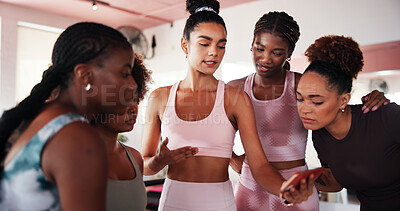 Buy stock photo Women, phone and group with talk at gym for advice, results and teaching at fitness club. People, friends and smartphone with mobile app, video and coach for learning, listen and exercise at class