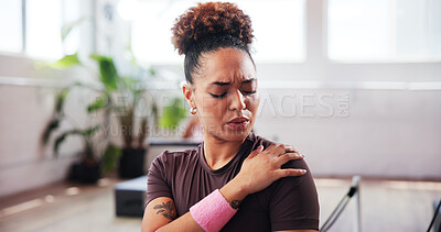 Buy stock photo Gym, fitness and woman with shoulder pain for injury, muscle tension and inflammation in studio. Breathing, female person and wellness with hand massage for joint ache, discomfort or sore for workout