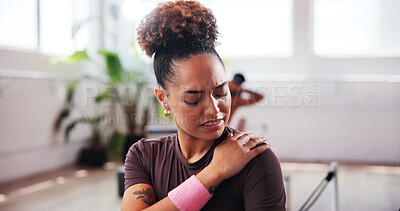 Buy stock photo Gym, ache and woman with shoulder pain for fitness, muscle tension and inflammation in studio. Burnout, female person and wellness with hand massage for joint injury, discomfort or sore for workout