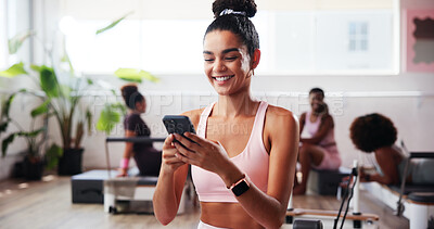 Buy stock photo Fitness, happy woman and online with phone in gym, health club and application for chat. Streaming, female person or scroll with mobile for exercise video, social media or virtual tutorial for cardio