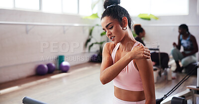 Buy stock photo Gym, exercise and woman with shoulder pain for fitness, muscle tension and inflammation in studio. Health club, female person and wellness with massage for joint ache, workout injury and relief