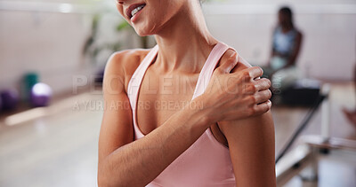 Buy stock photo Gym, hand and woman with shoulder pain for fitness, muscle tension and inflammation in studio. Health club, female person and wellness with massage for joint injury, discomfort and sore for workout