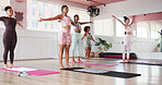 Yoga, health or women in class for stretching body, flexibility and wellness for balance or posture. Group, studio and people in pilates with support or activity for muscle strength, fitness and club