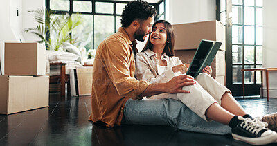 Buy stock photo Tablet, love and couple in new home with planning for renovation, development or moving. Cardboard boxes, real estate and man with woman on digital technology for online order in apartment together.