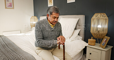Buy stock photo Senior man, walking stick and thinking in home, pray or rehabilitation for healing injury in bedroom. Elderly person with disability, cane and religion with eyes closed for miracle recovery in house