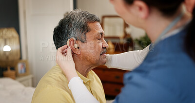 Buy stock photo Nurse, senior man and hearing aid with support, innovation and healthcare for retirement. Patient with disability, caregiver and pensioner with nursing home, rehabilitation and medical implant