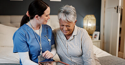 Buy stock photo Tablet, laughing and nurse with senior woman in bedroom for medical checkup with funny joke. Happy, bonding and healthcare worker with elderly female patient on bed with technology for treatment plan