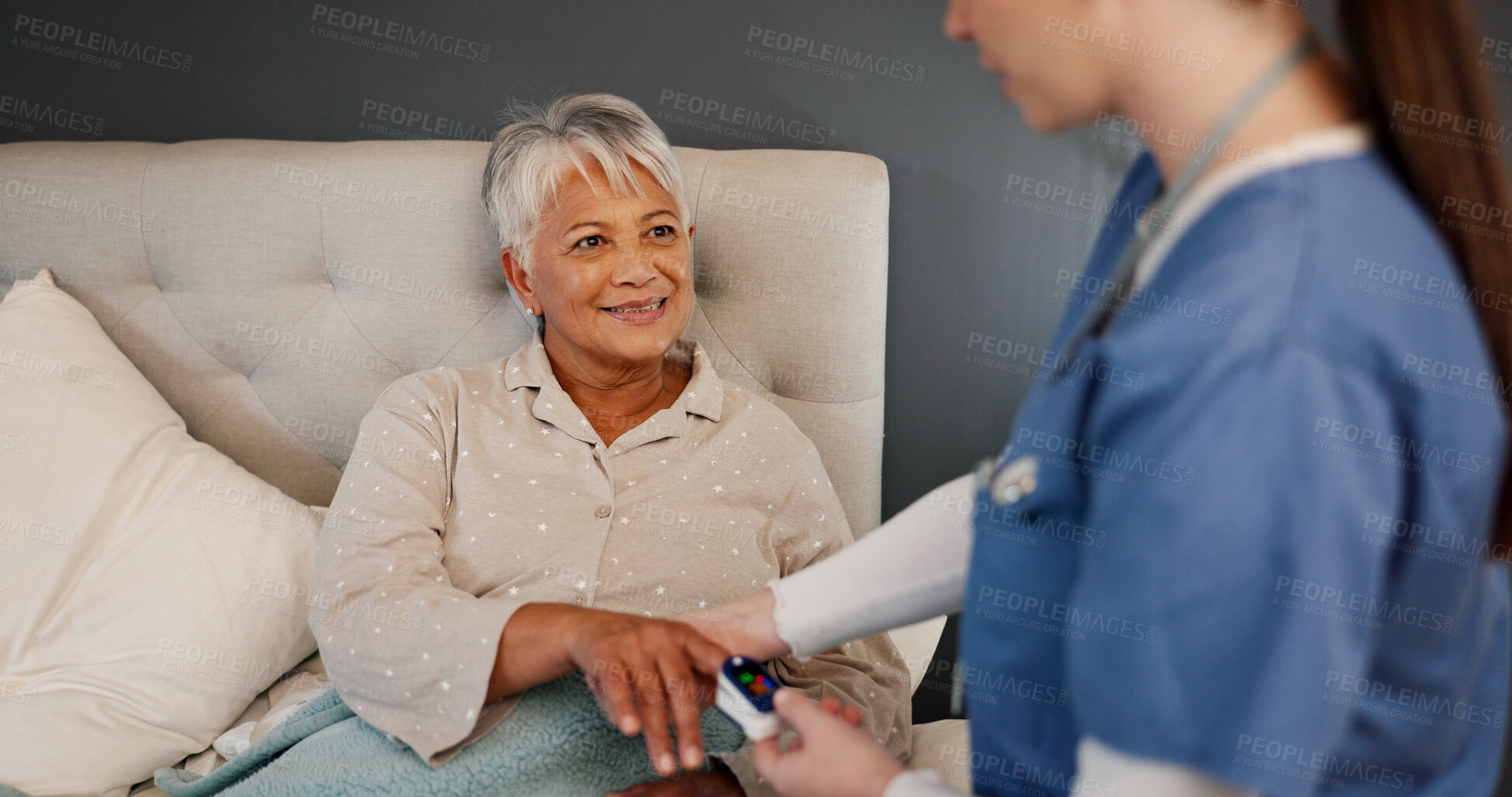 Buy stock photo Nursing home, women and caregiver with pulse oximeter, care and checking for oxygen saturation level. Healthcare, nurse and elderly patient in bedroom, happiness or equipment for respiratory function