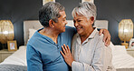 Bedroom, senior couple and smile with hug for support, bonding together and conversation in marriage. Old people, man and woman with laughing for funny joke, connection and love in retirement at home
