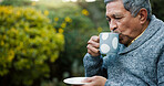 Outdoor, coffee and senior man in garden for morning relax, peace and calm in backyard of home. Retirement, wellness and elderly person drinking green tea in nature at nursing facility for health.