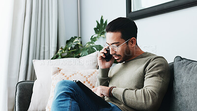 Buy stock photo Phone call, tablet and man on sofa in home for client feedback with freelance job. Cellphone, networking and person with digital technology in living room for mobile discussion with online review.
