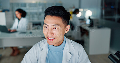 Buy stock photo Laboratory, scientist and happy man on reading for research, medical innovation and discovery. Night, testing results and doctor with smile for pharmaceutical review, medicine report or news