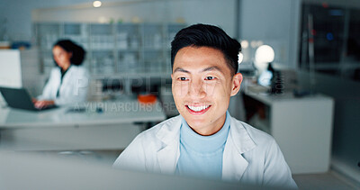 Buy stock photo Laboratory, doctor and man with computer for reading, medical research and happiness at night. Career, asian person and scientist with digital for pharmaceutical review, medicine report and results