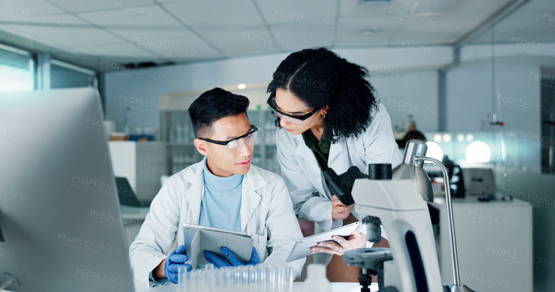 Buy stock photo Lab, science and people with microscope and tablet for medical research, meeting and teamwork. Healthcare, biotechnology and man and woman with equipment for sample, experiment and cure for vaccine