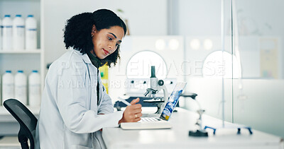 Buy stock photo Medicine, scientist and woman in lab for writing research, medical innovation and discovery. Biology, laptop and doctor with notebook for pharmaceutical review, science report and testing results
