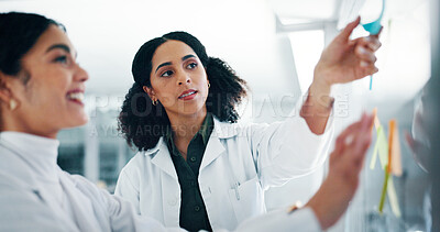 Buy stock photo Lab, scientist and women with medical research, collaboration and colleagues with sticky notes for info. Brainstorming, reading and teamwork for healthcare in clinic, pharmaceutical and plan for cure