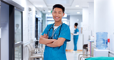 Buy stock photo Nurse, asian man and smile with arms crossed at clinic for medical support, healthcare service and career pride. Medicine, doctor and confidence for medicare, health treatment or about us at hospital