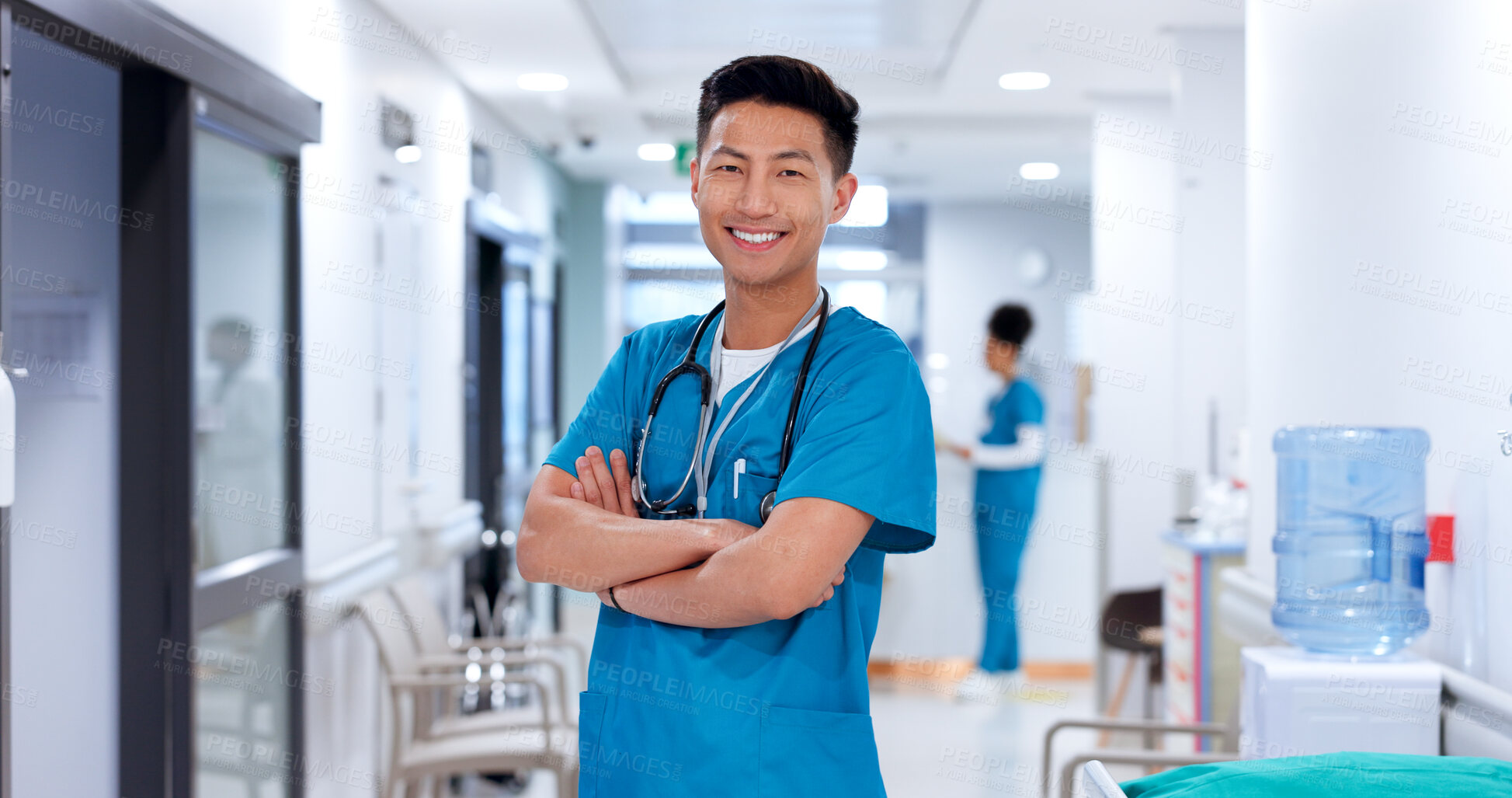 Buy stock photo Nurse, asian man and smile with arms crossed at clinic for medical support, healthcare service and career pride. Medicine, doctor and confidence for medicare, health treatment or about us at hospital