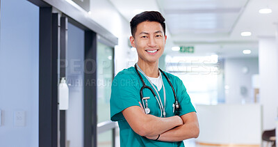 Buy stock photo Doctor, man and arms crossed with smile at hospital with job, stethoscope and pride for medical career. Asian person, happy and portrait with confidence for healthcare services at clinic in Cambodia