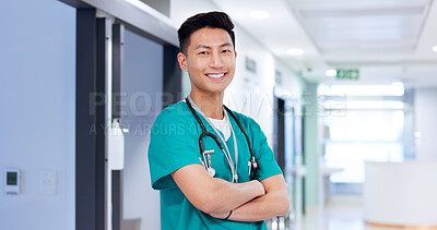 Buy stock photo Doctor, man and happy with arms crossed at hospital with job, stethoscope and pride for medical career. Asian person, smile and portrait with confidence for healthcare services at clinic in Cambodia