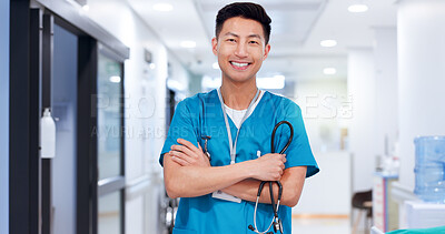 Buy stock photo Nurse, asian man and happy with arms crossed at hospital for medical service, healthcare and career confidence. Medicine, doctor and pride for medicare, professional support and wellness treatment