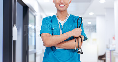 Buy stock photo Crossed arms, man and nurse with stethoscope in hospital for medical service or support. Happy, confident and professional male healthcare worker with pride for career in hallway at nursing clinic.