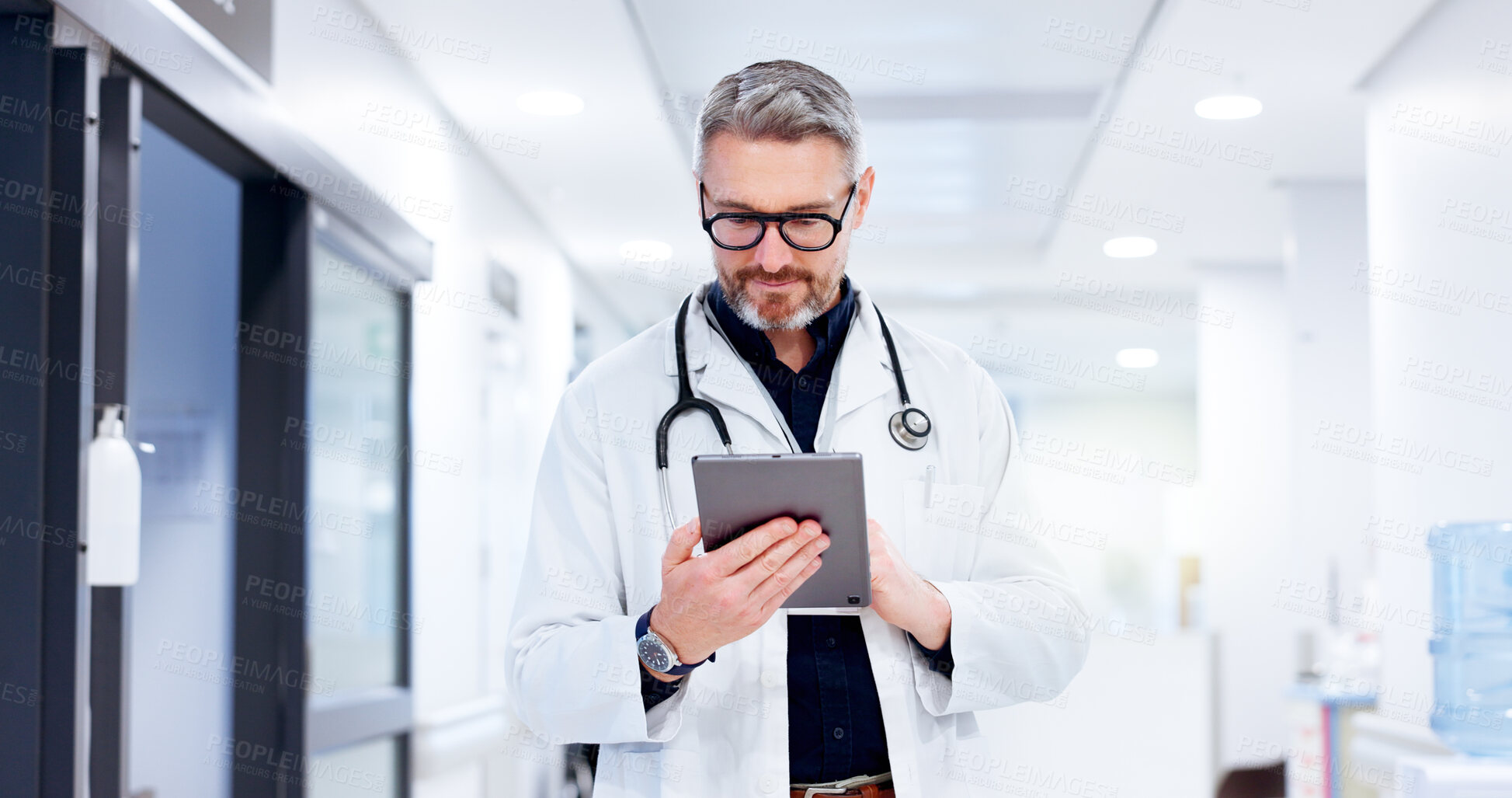 Buy stock photo Healthcare, man and doctor with tablet for reading, patient information and medical research. Hospital, mature person and surgeon with digital for diagnosis results, review and report for treatment