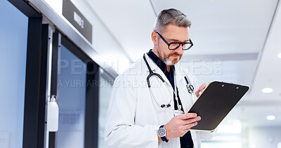 Buy stock photo Doctor, healthcare and man with clipboard at hospital for patient health report, medical research and information. Medicine, mature person and documents for insurance paperwork and reading results