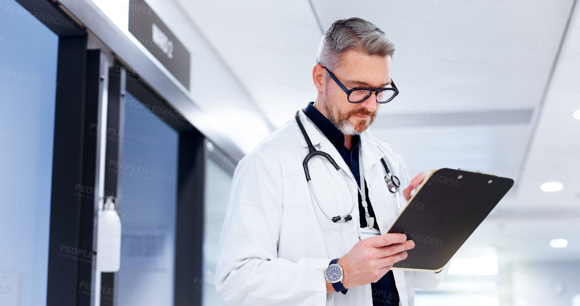Buy stock photo Doctor, healthcare and man with clipboard at hospital for patient health report, medical research and information. Medicine, mature person and documents for insurance paperwork and reading results