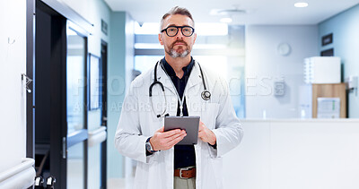 Buy stock photo Healthcare, doctor and man in hospital, tablet and internet with cancer research, pride and career ambition. Serious, mature person and medical with professional in clinic or technology for schedule