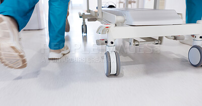 Buy stock photo Gurney, legs and medical with doctors in hospital for emergency, operation or surgery. Staff, rushing and urgency with team of medicine professionals running in hallway to save patient or victim