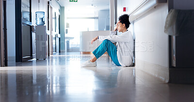 Buy stock photo Burnout, woman and doctor in hallway, thinking or sad with depression, bad news or medical challenge. Person, stress or professional in corridor, mistake or pressure with failure in emergency service