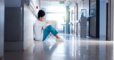 Buy stock photo Stress, woman and doctor in hallway, thinking or sad with depression, burnout or challenge. Person, medical or professional in lobby, mistake or pressure with failure in emergency service or bad news