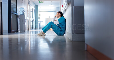 Buy stock photo Burnout, woman or doctor in lobby, thinking or sad with depression, mistake or medical challenge. Person, mental health or professional in corridor, bad news and failure in emergency service or tired