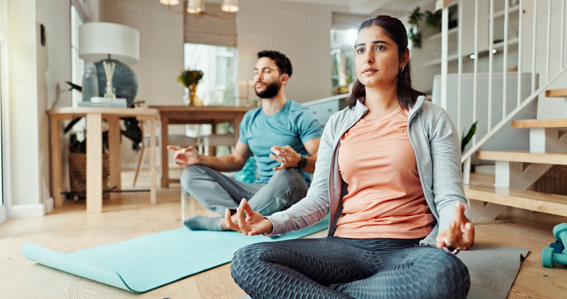 Buy stock photo Fitness, inner peace and meditation with couple in living room of home for bonding, health or wellness together. Balance, exercise or yoga with man and woman in apartment for holistic awareness