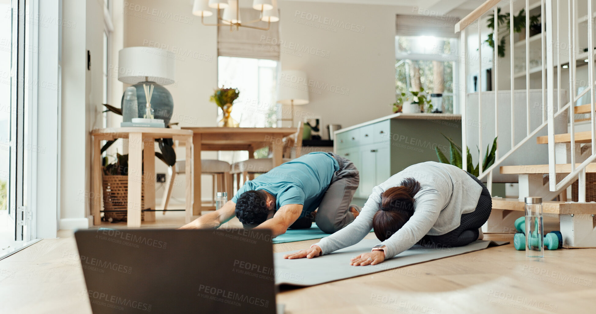 Buy stock photo Exercise, laptop and stretching with couple in living room of home for bonding, health or yogi wellness together. Fitness, holistic or yoga with man and woman in apartment for online course.