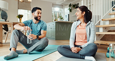 Buy stock photo Fitness, smile and water with couple in living room of home for bonding, health or wellness together. Exercise, hydration or yoga with man and woman in apartment for balance, relationship or relax