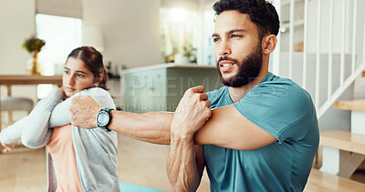 Buy stock photo Arm, fitness and stretching with couple in living room of home for bonding, health or wellness together. Exercise, getting ready or warm up with man and woman in apartment for balance or preparation