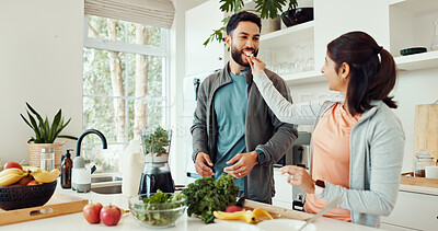Buy stock photo Feeding, ingredients and couple with smoothie in home for wellness, nutrition or diet breakfast. Groceries, eating and man helping woman with blender for juice detox in kitchen at apartment together.