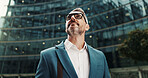 Business, thinking and man in city, below and ideas with wonder, urban town and commute. Mature person, financial advisor and consultant in street, ideas and planning with decision, choice and travel