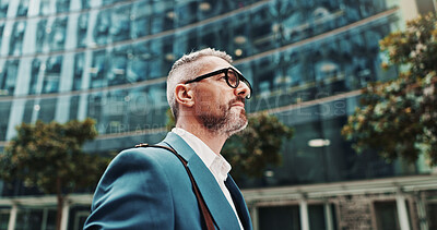 Buy stock photo Business, thinking and man in city, walking and ideas with wonder, choice and commute. Mature person, financial advisor or consultant in street, decision and contemplation with break, below or travel