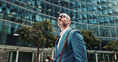 Buy stock photo Travel, thinking or man in city with phone, appointment or ideas in urban town for opportunity. Mobile, financial advisor or mature consultant in low angle for corporate career, commute or decision