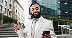 Business, headphones and man with smartphone, outdoor and smile with audio, listening to music and dancing. Happy person, celebration and consultant in street, cellphone and headset with sound or app