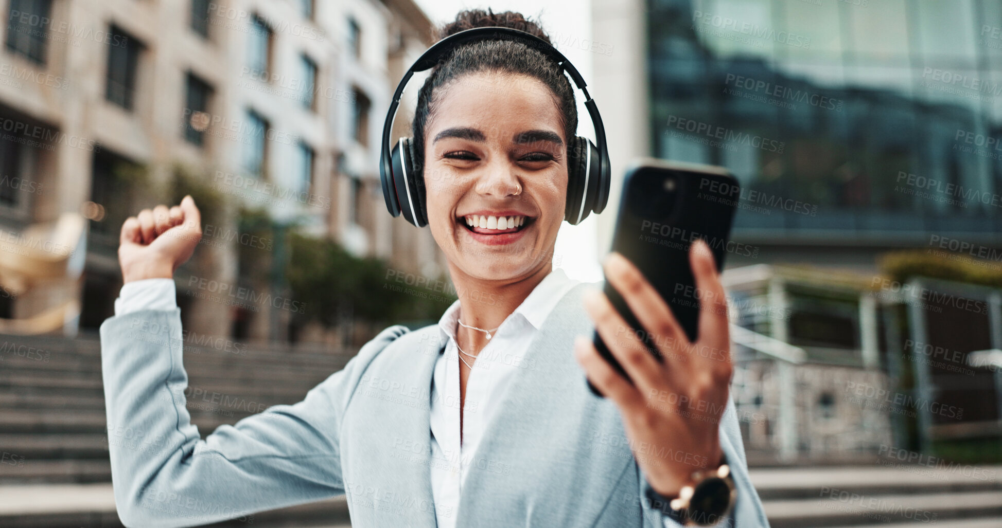 Buy stock photo Business, headphones and woman with cellphone, excited and dancing with audio, listening to music and sound. Happy person, employee and consultant in city, energy and headset with success and radio