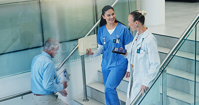 Buy stock photo People, stairs and doctors in hospital, conversation and smile with advice, feedback or talking. Medical, women or professional in clinic, discussion or communication with mentor, steps or healthcare