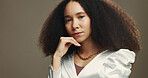 Beauty, cosmetics and portrait of woman in studio for wellness, skincare and facial treatment. Salon, spa and face of person with natural hair for texture, growth and shine on brown background